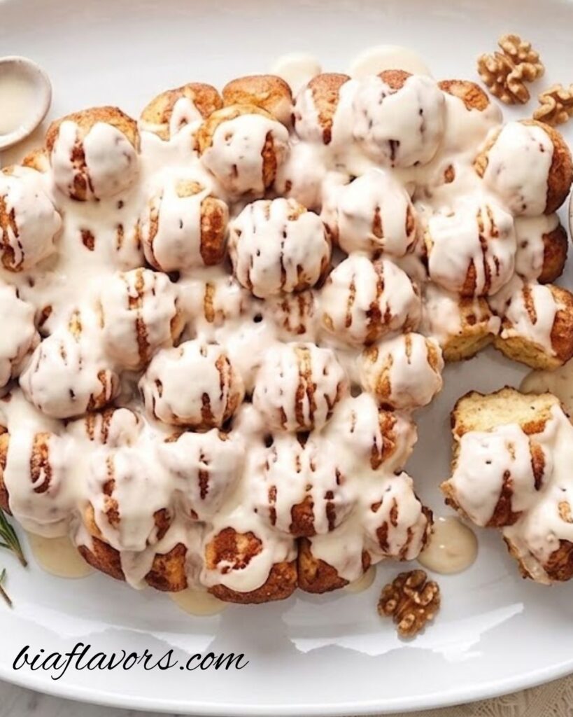 Bite-sized cinnamon rolls served warm with vanilla icing glaze