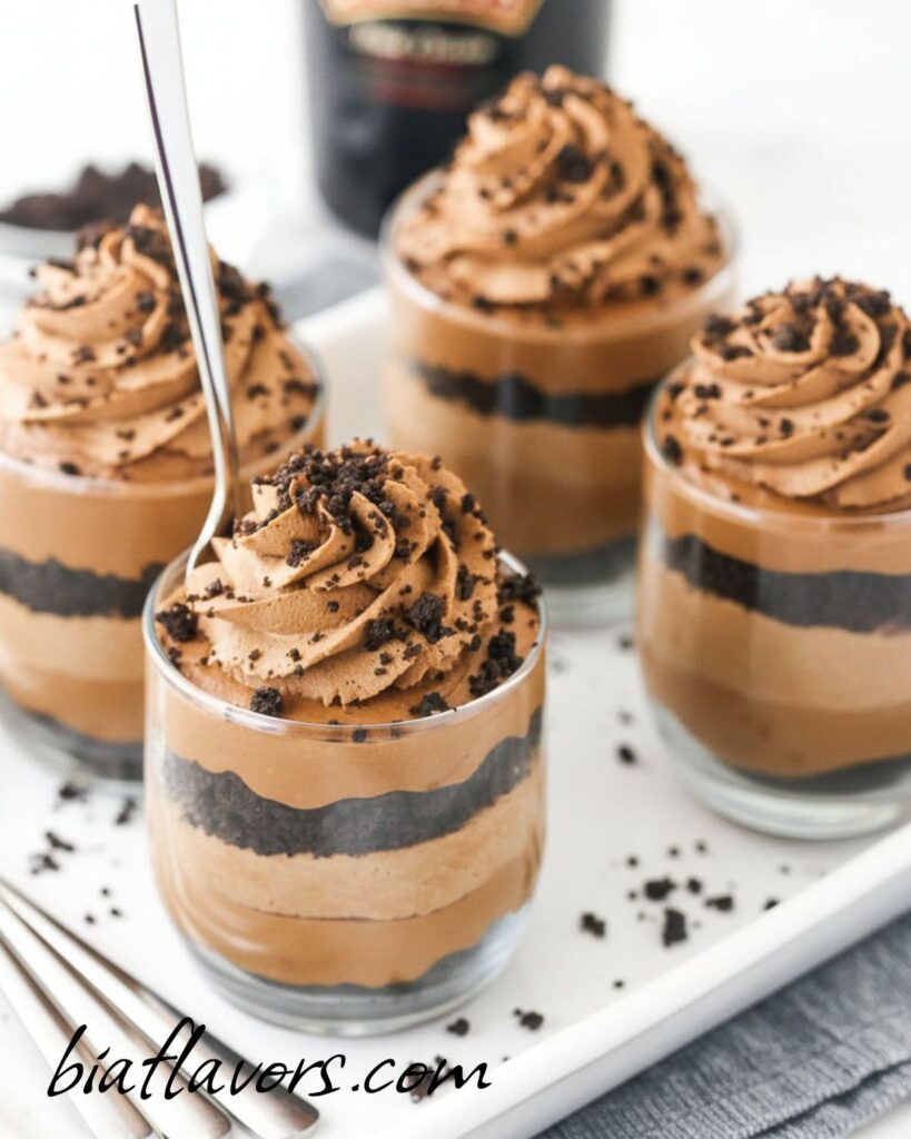 Mini Baileys chocolate cheesecake trifles layered with creamy chocolate and whipped topping