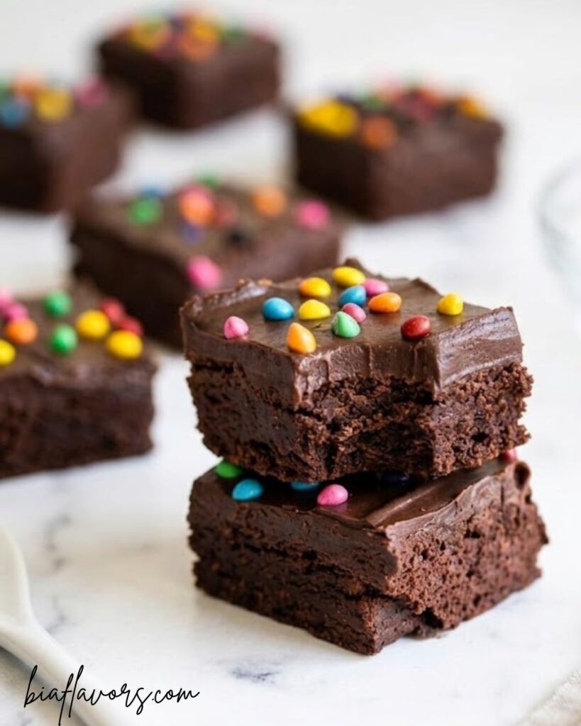 thick and chewy chocolate brownies topped with mini M&Ms