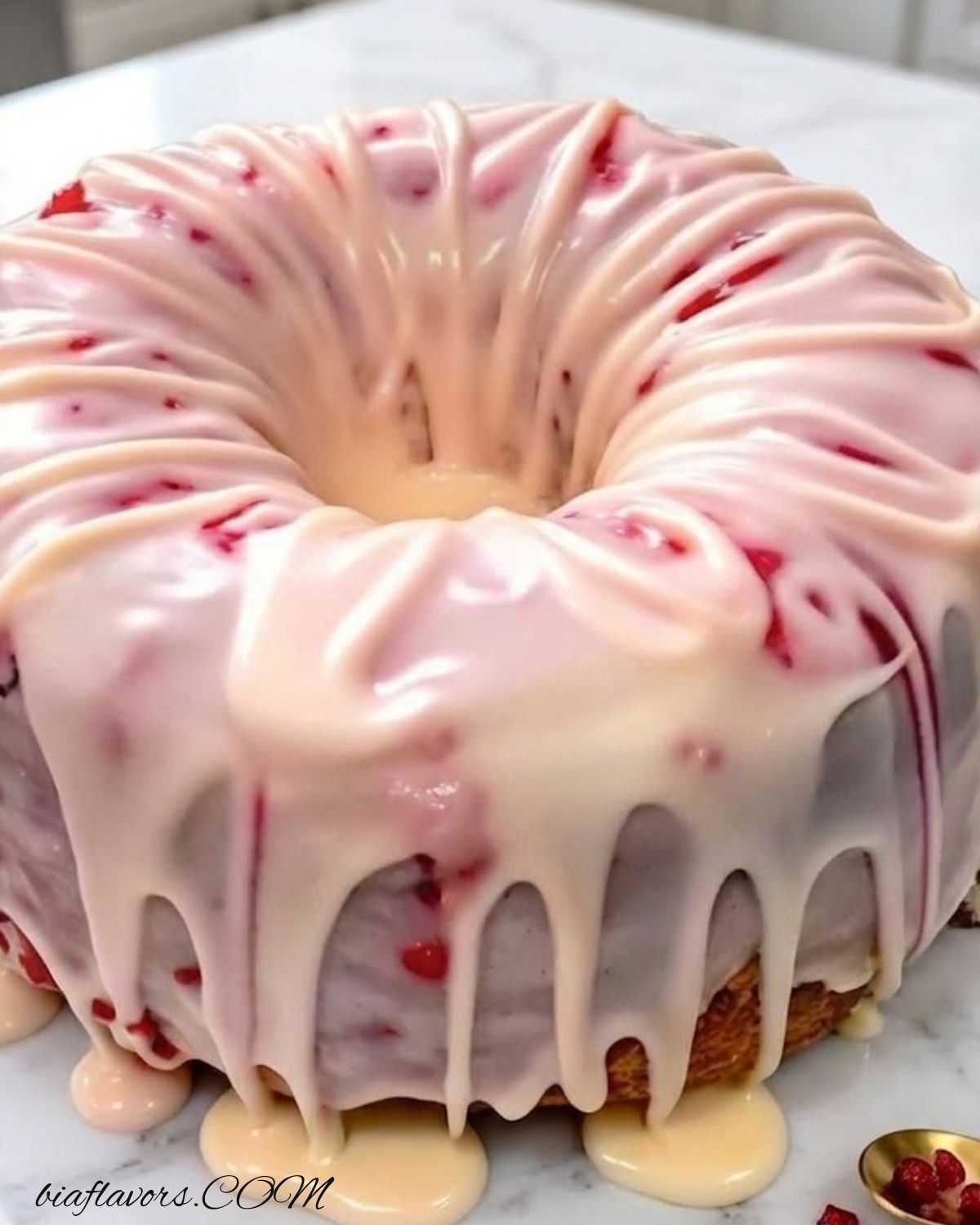 Slice of strawberry pound cake showing soft texture and fresh strawberries