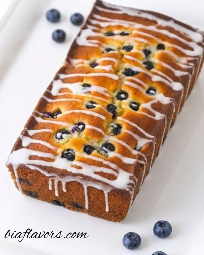 Homemade lemon blueberry bread on a cooling rack